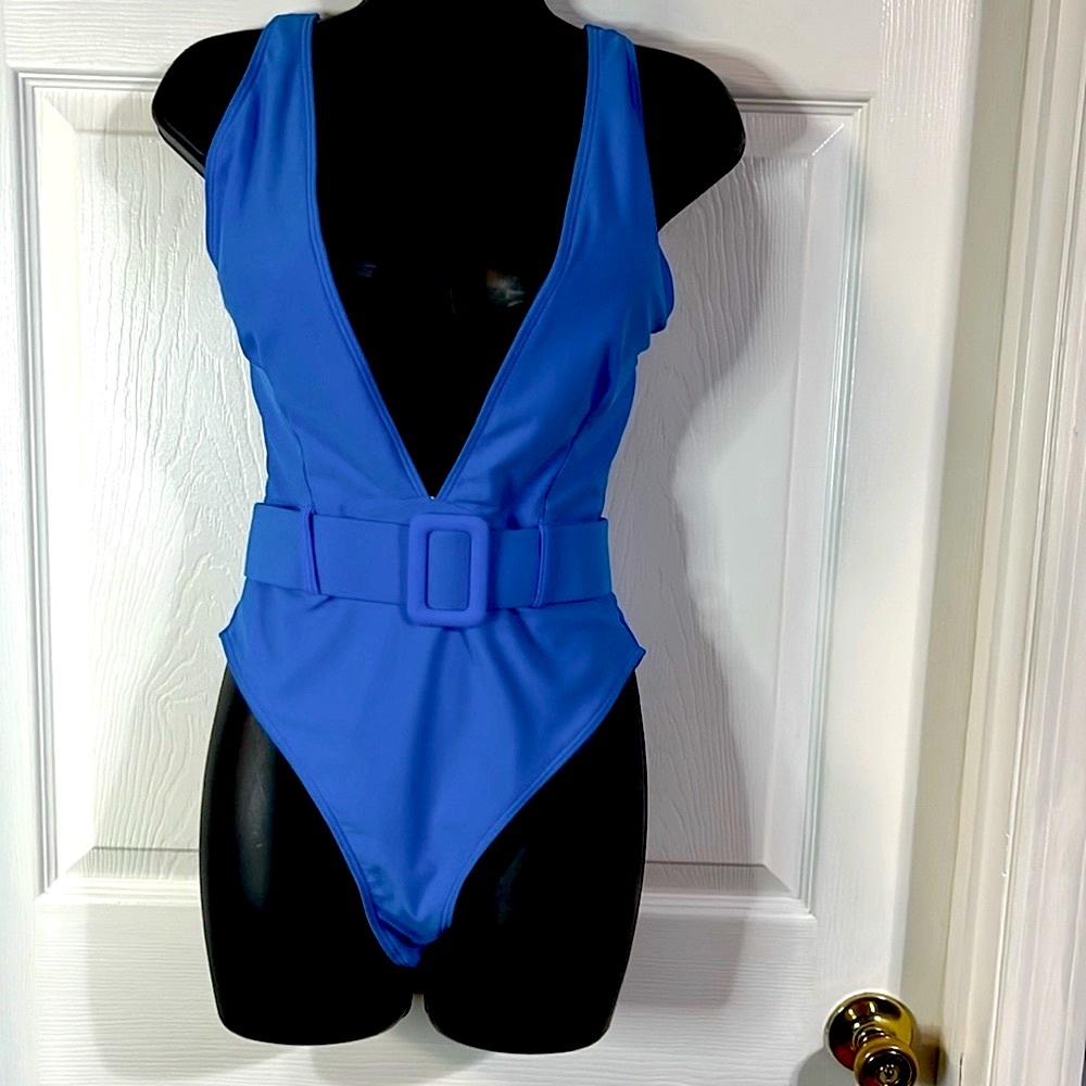 Pretty royal blue one piece swim suit, size medium, NWT.